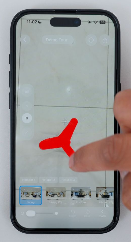 Painting a red selection over the tripod legs at the bottom of a 360 photo in Clear Pano